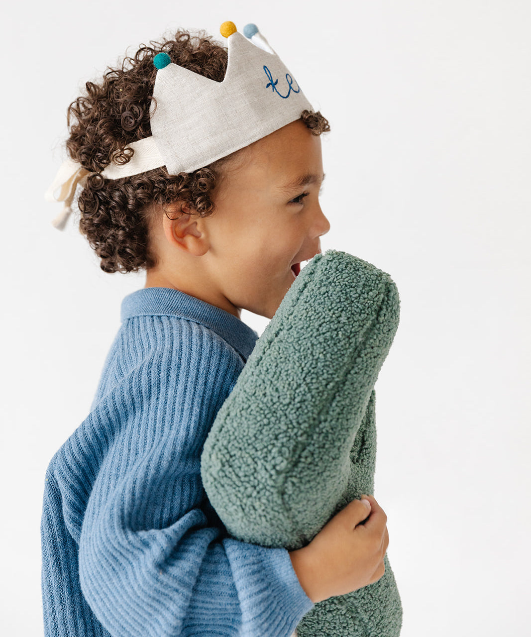 Side view of boy wearing adjustable handmade birthday crown