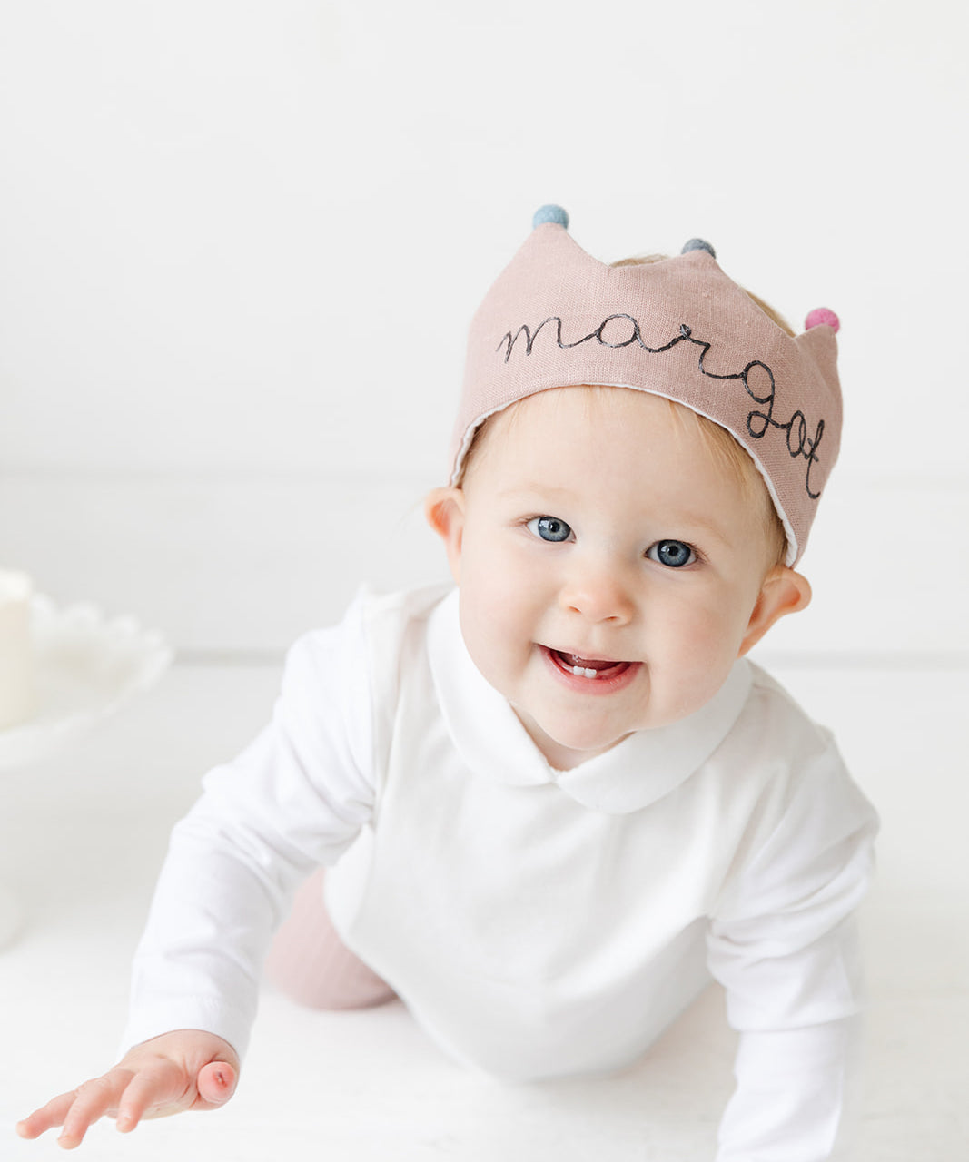 baby with first birthday crown