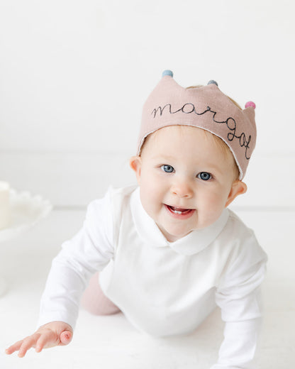 baby with first birthday crown