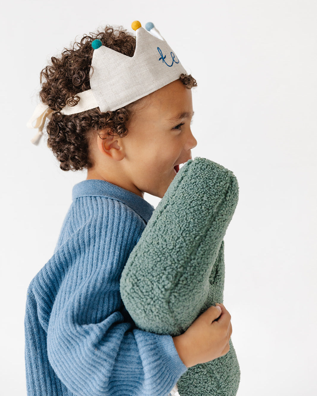 Side view of boy wearing adjustable handmade birthday crown